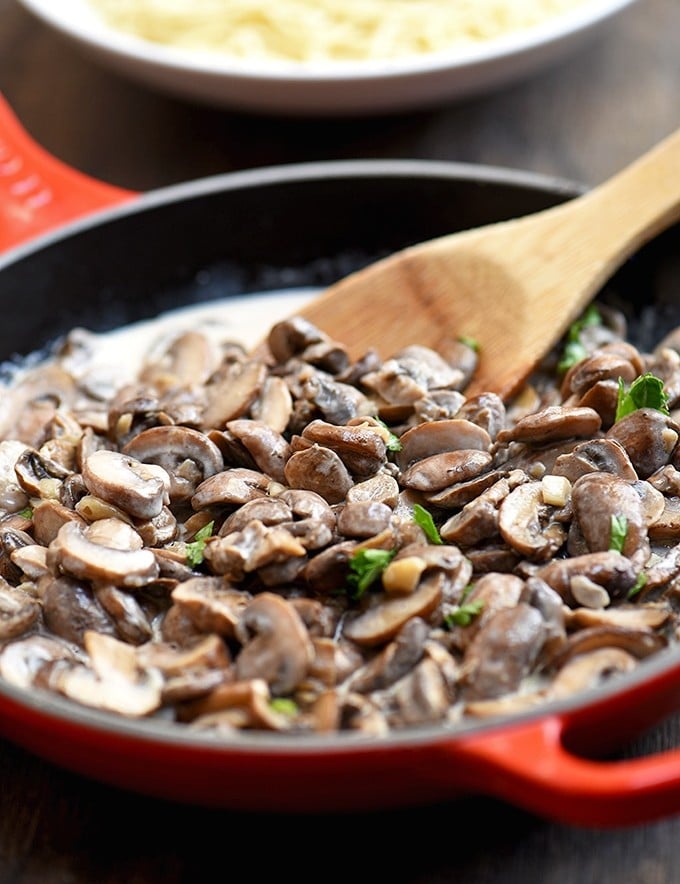 Creamy Garlic Mushrooms with deliciously browned cremini mushrooms and garlicky cream sauce. Fantastic as a side dish, over pasta, or on toast!