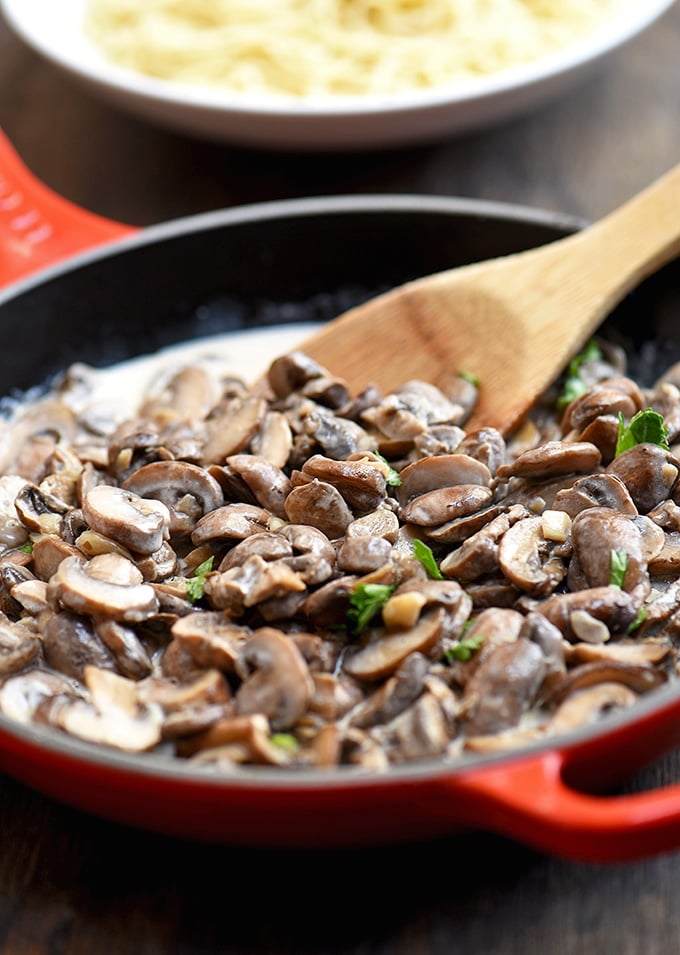 Creamy Garlic Mushrooms with deliciously browned cremini mushrooms and garlicky cream sauce. Fantastic as a side dish, over pasta, or on toast!