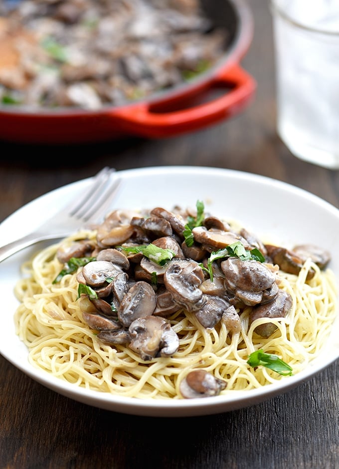 Creamy mushroom pasta sauce tossed with angel hair for a scrumptious vegetarian dish