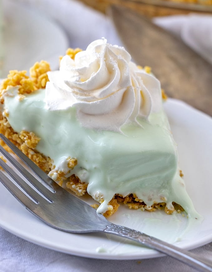 sliced frozen margarita pie on a white serving plate