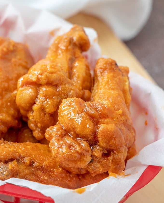 homemade buffalo wings in a red basket