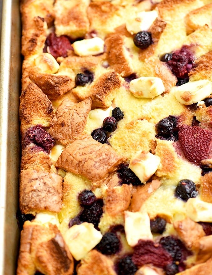 Mixed Berry French Toast Bake is easy to make and ready in an hour with no overnight chilling needed. With delicious pockets of berries and cream cheese, and topped with fruit sauce, it's perfect for breakfast or brunch.