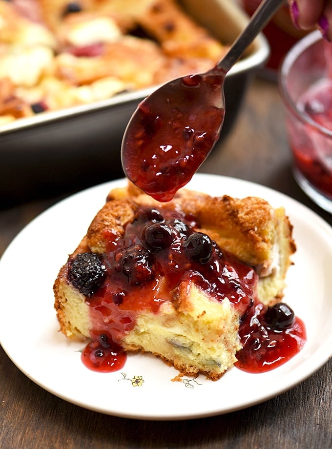 Mixed Berry French Toast Bake with berries, cream cheese and fruit sauce topping. So easy to make and so delicious!