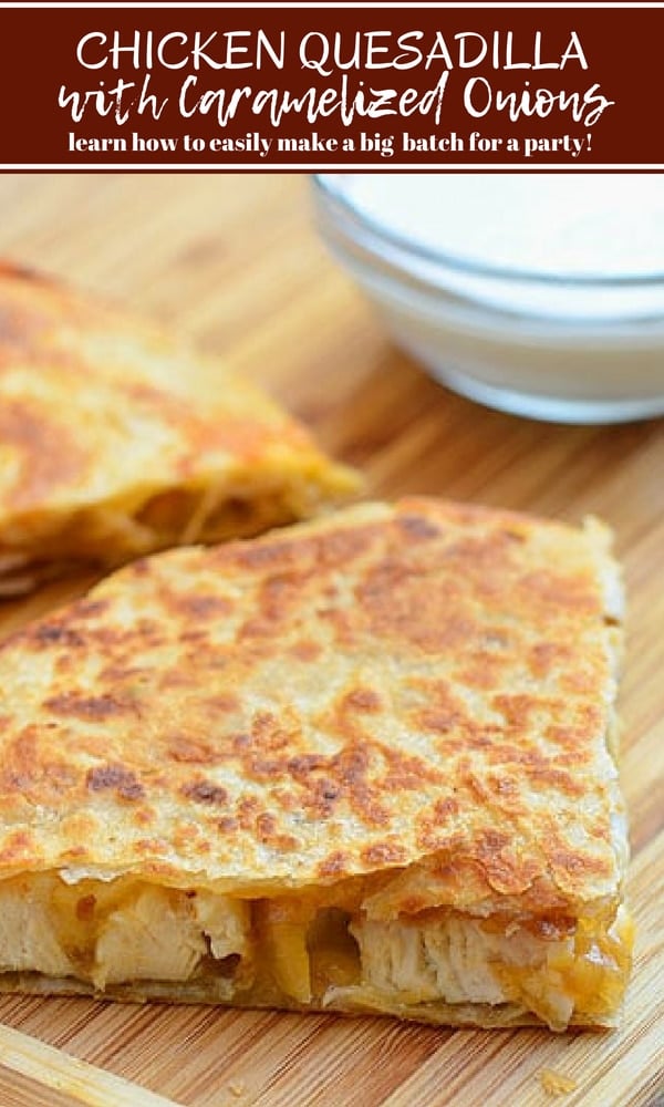 sliced chicken quesadilla with caramelized onions on a cutting board