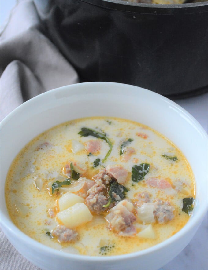 Tuscan soup in a white bowl