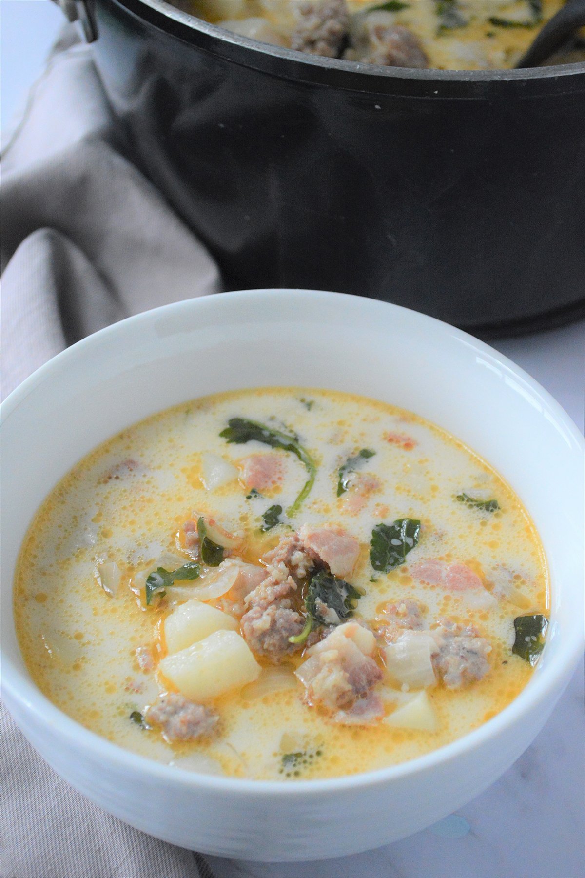 Tuscan soup in a white bowl