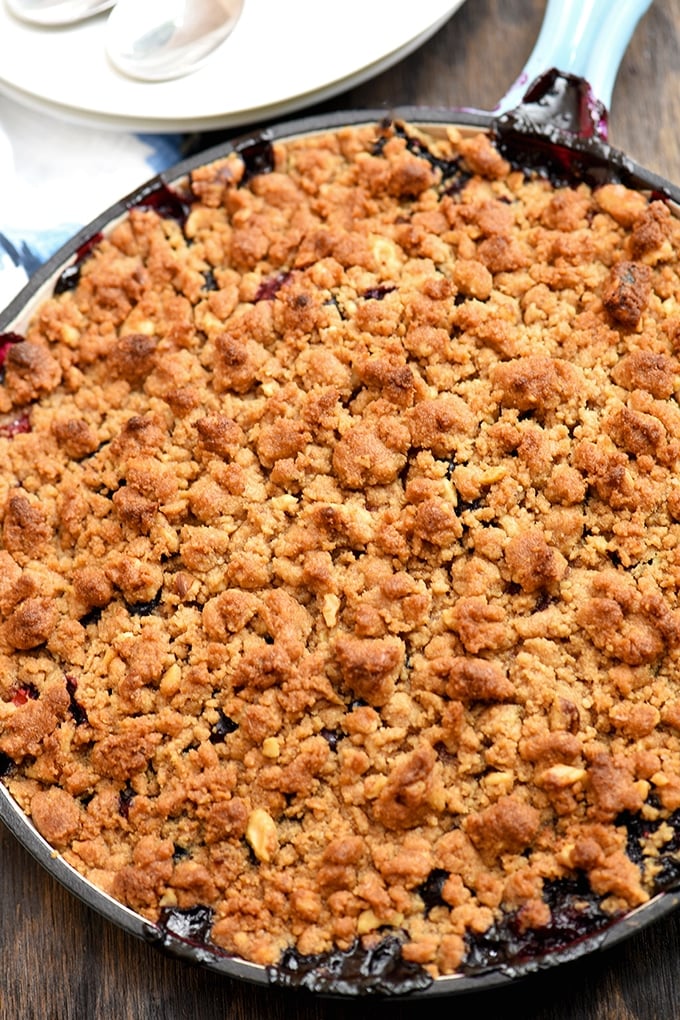 Top view of berry crumble baked in blue skillet