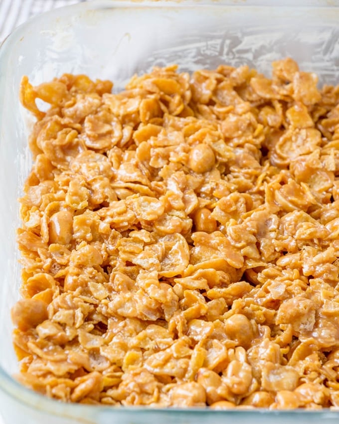 No-bake peanut caramel squares are a fantastic sweet and salty treat. Gooey, chewy and loaded with peanuts and cornflakes, they're seriously addicting!