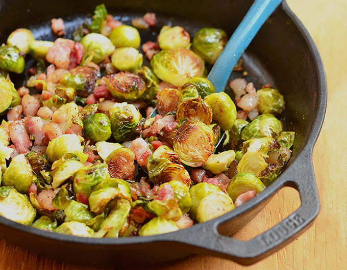 Roasted Brussels Sprouts with Garlic and Pancetta are smoky, crunchy, peppery, garlicky and like a party in your mouth! Loaded with Pancetta bits and garlic, they pack big, bold flavors you won't be able to get enough!