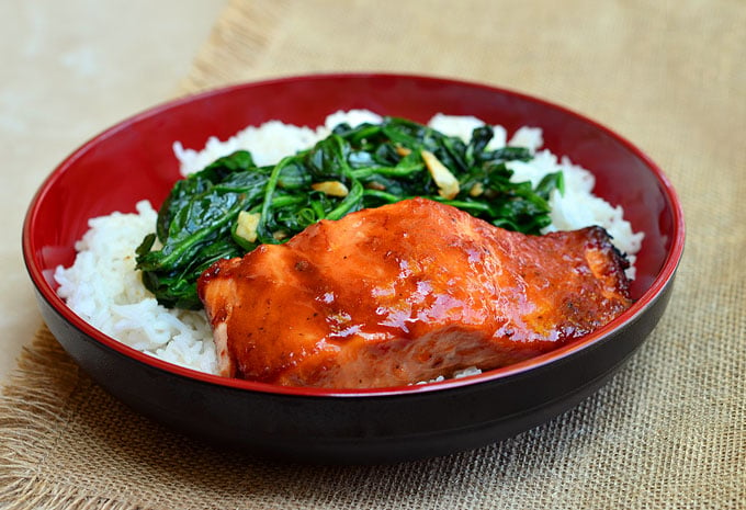 Baked Salmon with Sweet Chili Glaze and a side of Garlic Spinach is a nutritious, flavorful dinner!