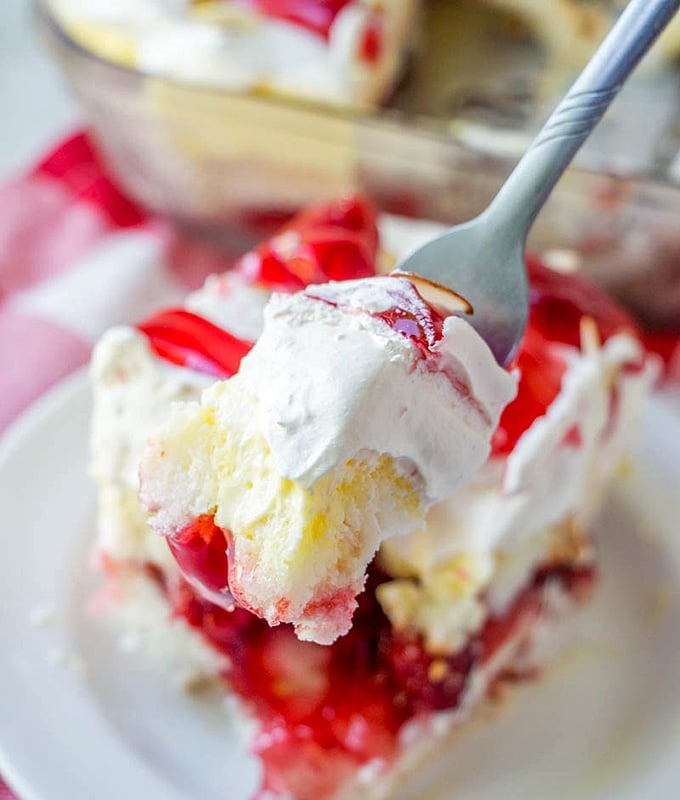 angel food cake trifle with cherry pie filling on a fork