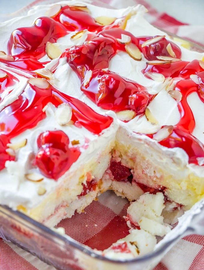 Angel food cake trifle with cherry pie filling in a casserole dish