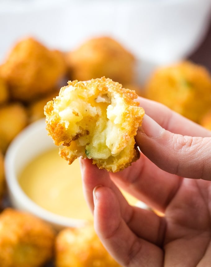 holding half potato ball with fingers