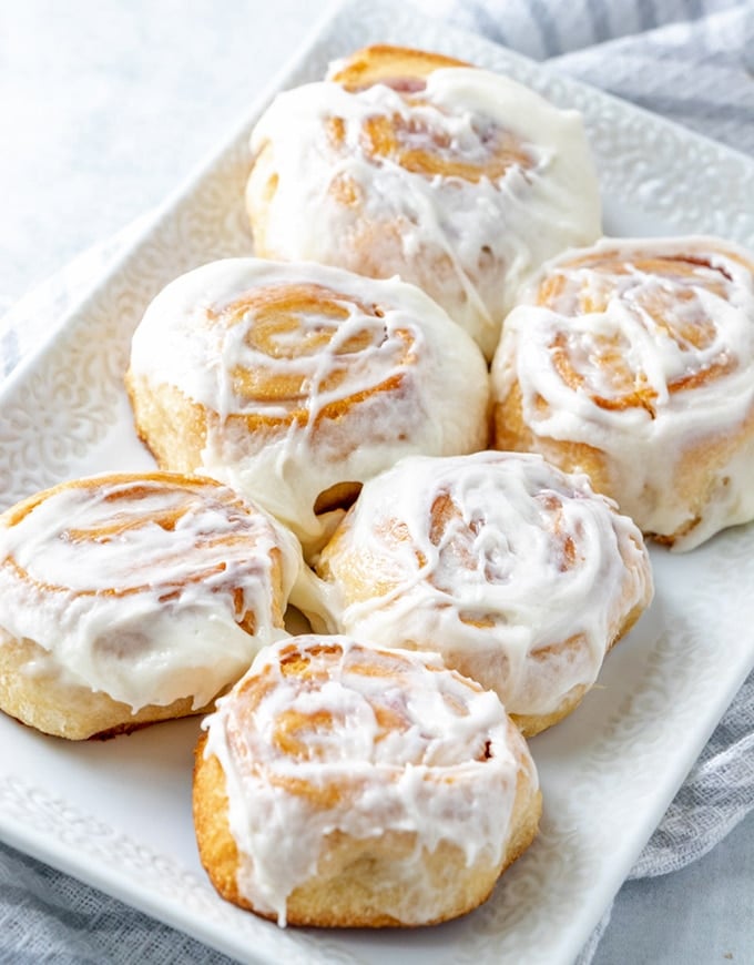 Raspberry Cheese Danish with cream cheese frosting on a white serving platter