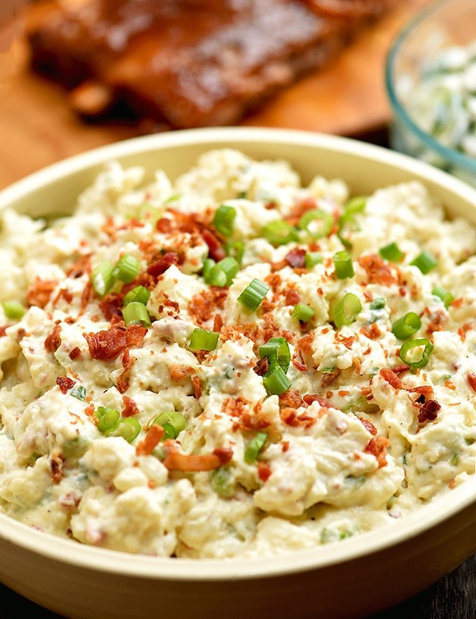 Loaded Potato Salad with bacon crumbles, chopped eggs, crisp celery and green onions