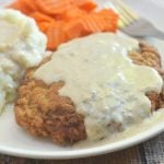 Country Fried Steak with Creamy Gravy made crispy, super tender and tasty using a buttermilk marinade. Hearty and delicious with a flavorful milk gravy, it is the ultimate comfort food.