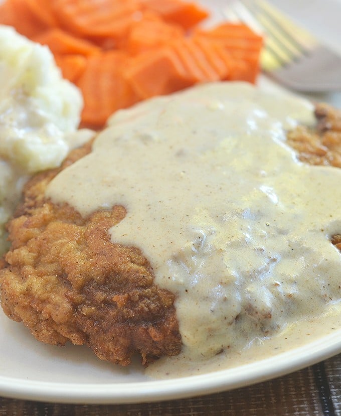 Country Fried Steak with Creamy Gravy made crispy, super tender and tasty using a buttermilk marinade. Hearty and delicious with a flavorful milk gravy, it is the ultimate comfort food.