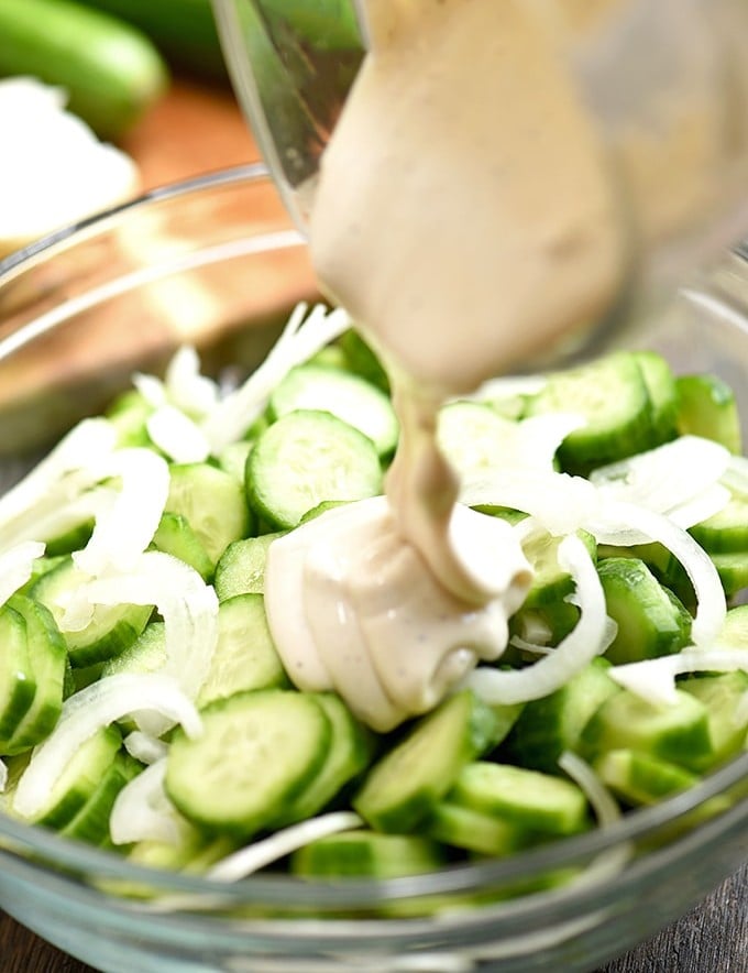 sliced cucumbers and sweet onions drizzled with mayo dressing