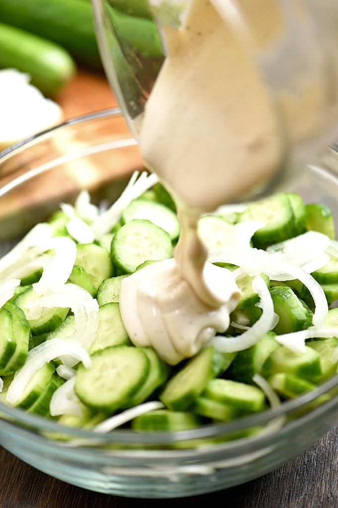 sliced cucumbers and sweet onions drizzled with mayo dressing