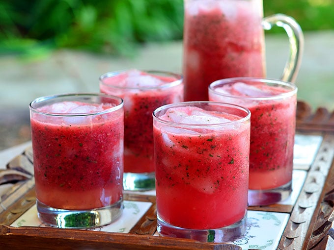 Minty Watermelon Cooler made with fresh watermelon, lime juice, and mint is a delicious way to beat the heat! A few splashes of vodka or rum easily turn it into a grown-up cocktail!