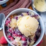 Mixed Berry Cobbler in a bowl with vanilla ice cream