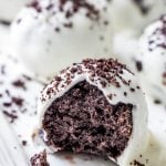 Oreo Truffle Balls with white chocolate coating and cookie crumbs on a serving platter