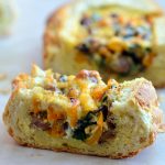 Baked Eggs in Bread Boat filled with eggs, sausage, vegetables, and cheese is the best way to start the day! Crusty french loaves baked until golden and bubbly are perfect for everyday breakfast or a special Sunday brunch.