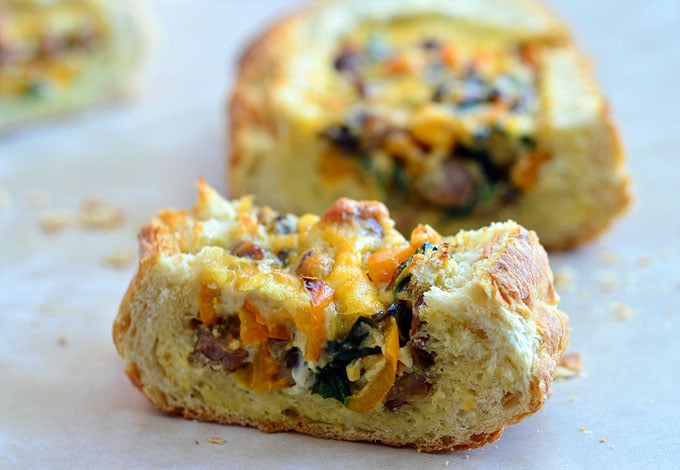 Baked Eggs in Bread Boat filled with eggs, sausage, vegetables, and cheese is the best way to start the day! Crusty french loaves baked until golden and bubbly are perfect for everyday breakfast or a special Sunday brunch.