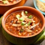 Easy chicken tortilla soup recipe loaded with all the good stuff. With moist chicken, black beans, corn, and crisp tortilla strips, it's hearty and delicious!