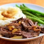 Slow Cooker Cola Roast with sweet, spicy flavors and moist, tender meat. Cooked in the crockpot, it's a hands-off meal for easy weeknight dinners.