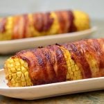Bacon-wrapped Corn with Chipotle Honey Glaze grilled to sweet, salty and smoky perfection are the best way to enjoy summer's corn!