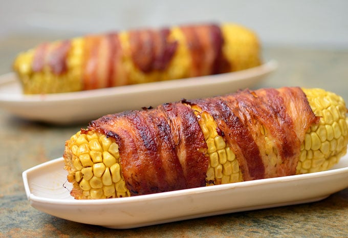 Bacon-wrapped Corn with Chipotle Honey Glaze grilled to sweet, salty and smoky perfection are the best way to enjoy summer's corn!