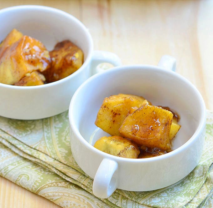 Candied Sweet Potatoes with Sherry Syrup baked in brown sugar, dry sherry, and pumpkin pie spice is a great addition to your Thanksgiving menu. With creamy potatoes and sweet syrup, it's delicious as dessert or side dish.