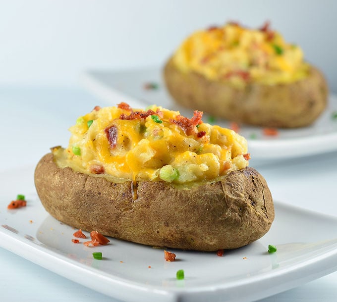 Loaded Twice-Baked Potatoes are a delicious side dish or satisfying light meal. Loaded with bacon, cheddar cheese, and green onions, they're hearty, delicious and guaranteed to a be a family favorite!