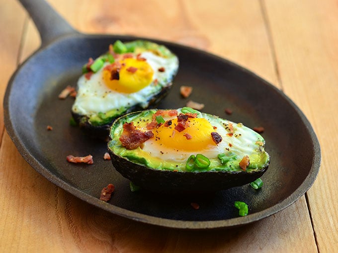 Avocado Egg Cups with runny yolks, crisp bacon, and green onions nestled in creamy avocados. They are a simple yet satisfying breakfast treat everyone would love waking up for!