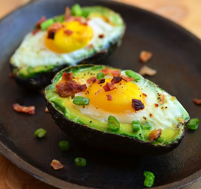 Avocado Egg Cups with runny yolks, crisp bacon, and green onions nestled in creamy avocados. They are a simple yet satisfying breakfast treat everyone would love waking up for!