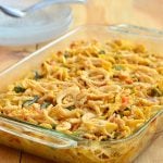 Easy-Cheesy Tuna Noodle Casserole is the best tuna casserole ever! Loaded with mixed vegetables, creamy sauce, and crispy french-fried onions, it's pure comfort food.