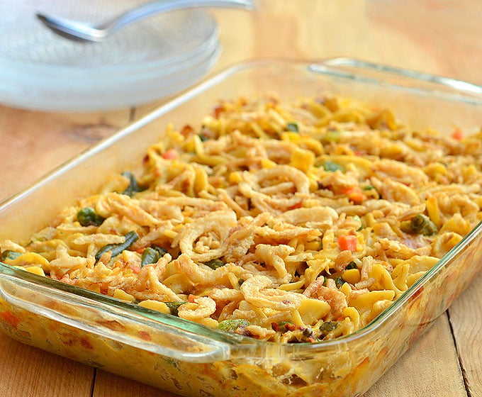 Easy-Cheesy Tuna Noodle Casserole is the best tuna casserole ever! Loaded with mixed vegetables, creamy sauce, and crispy french-fried onions, it's pure comfort food.