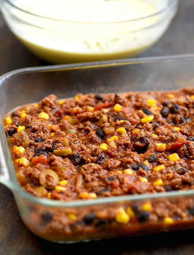 Beef Tamale Pie with a savory ground beef, corn, black beans, and olives filling. 