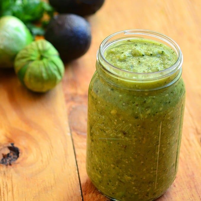 Avocado Tomatillo Salsa is about to become your top choice for condiment! Made with tomatillos, chili peppers, and avocado, it's amazing over tacos, breakfast eggs or any of your favorite foods for a delicious kick of flavor!