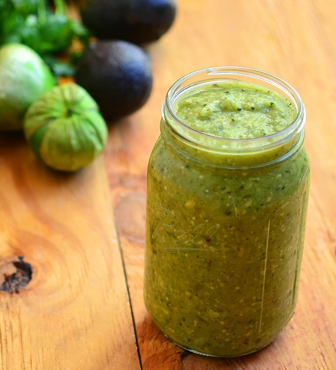 Avocado Tomatillo Salsa is about to become your top choice for condiment! Made with tomatillos, chili peppers, and avocado, it's amazing over tacos, breakfast eggs or any of your favorite foods for a delicious kick of flavor!