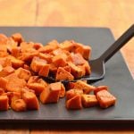 Roasted spiced sweet potatoes seasoned with spices and roasted until golden and crisp are the perfect Fall side dish. The perfect pair for any roasted meat, they're sure to be the star of your Thanksgiving festivities!