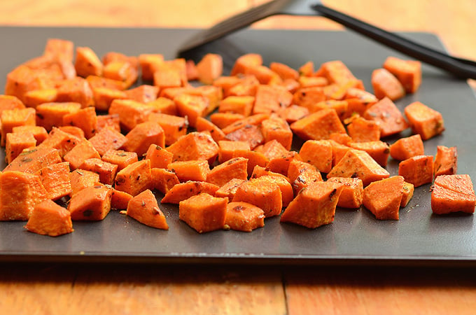 Roasted spiced sweet potatoes seasoned to perfection. Tender and flavorful, these are the perfect Holiday side dish