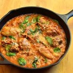 Tuscan Chicken with spinach, white beans, and an amazing tomato sauce. Hearty, delicious, and incredibly easy to make, it's a guaranteed to be a dinner favorite!