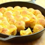 cheesy pull-apart bread rolls in a cast iron skillet