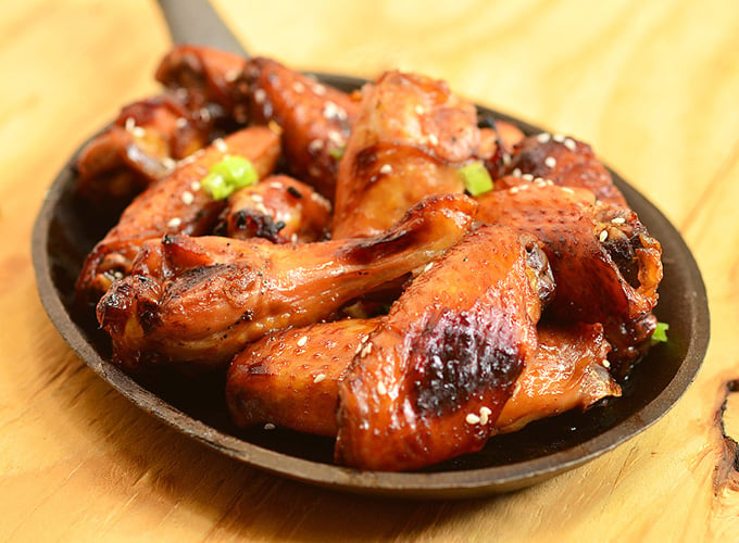 Honey Soy Chicken Wings are so easy to make and perfect for game day.  Marinated in soy sauce, honey, orange juice, and garlic mixture, they're sweet, salty, sticky, and finger-licking delicious!