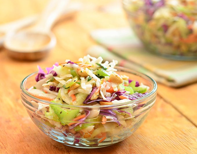 Peanut coleslaw with cabbage, carrots, celery, green onions, and crunchy peanuts dressed in a tangy vinaigrette dressing. A delicious Wood Ranch BBQ and Grill copycat recipe, it's sure to wow the crowd!