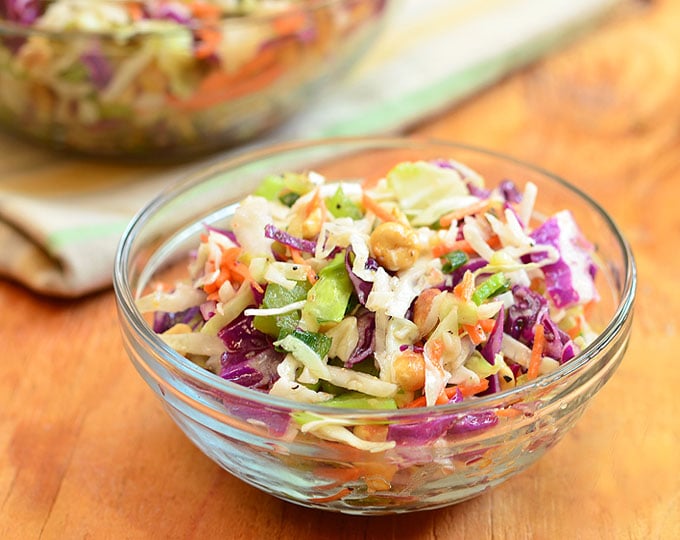 Peanut coleslaw with cabbage, carrots, celery, green onions, and crunchy peanuts dressed in a tangy vinaigrette dressing. A delicious Wood Ranch restaurant copycat recipe, it's sure to wow the crowd!