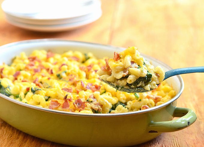 Baked Macaroni and Cheese hot and fresh from the oven. Loaded with bacon and spinach, it's the ultimate comfort food.