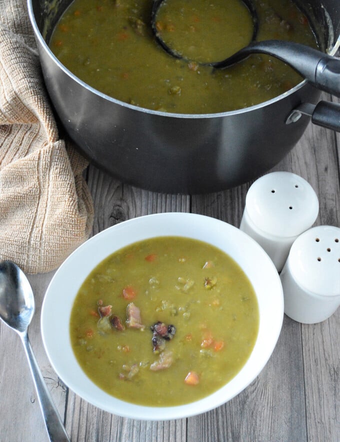 Split Pea and Ham Soup in pot and white bowl